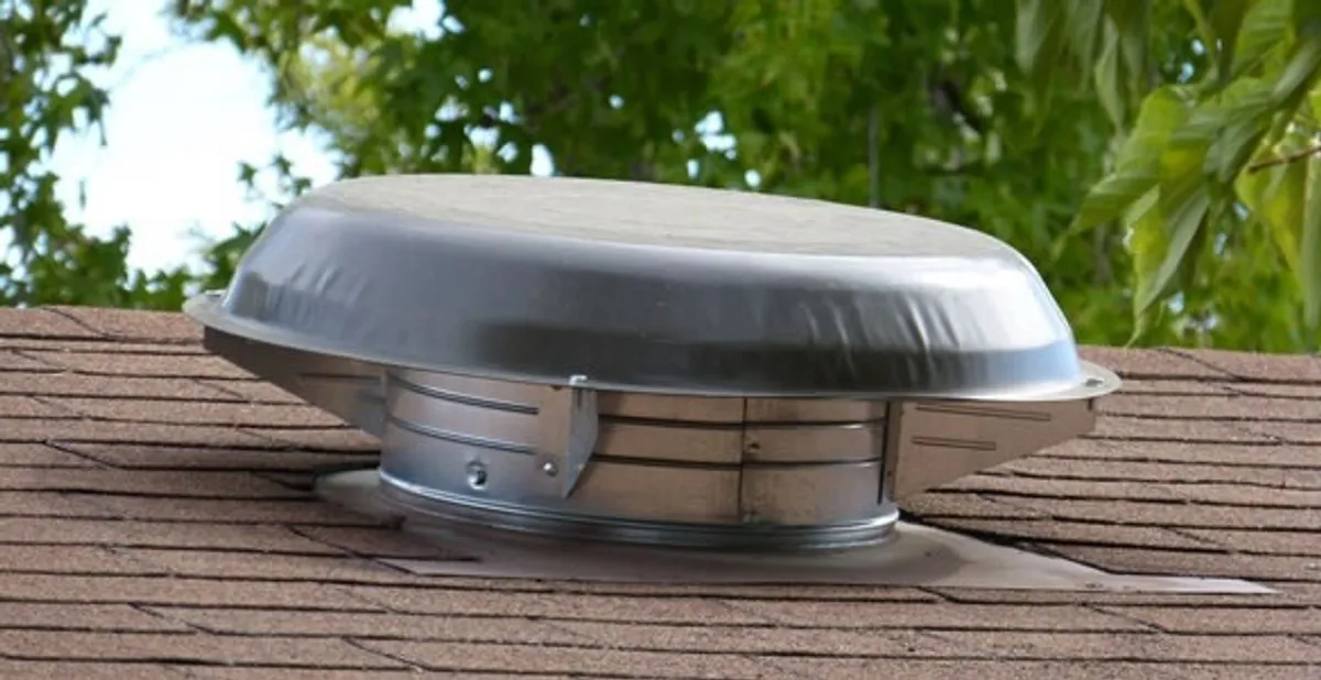 attic fan installation services with low-profile roof ventilation unit in Bakersfield, CA