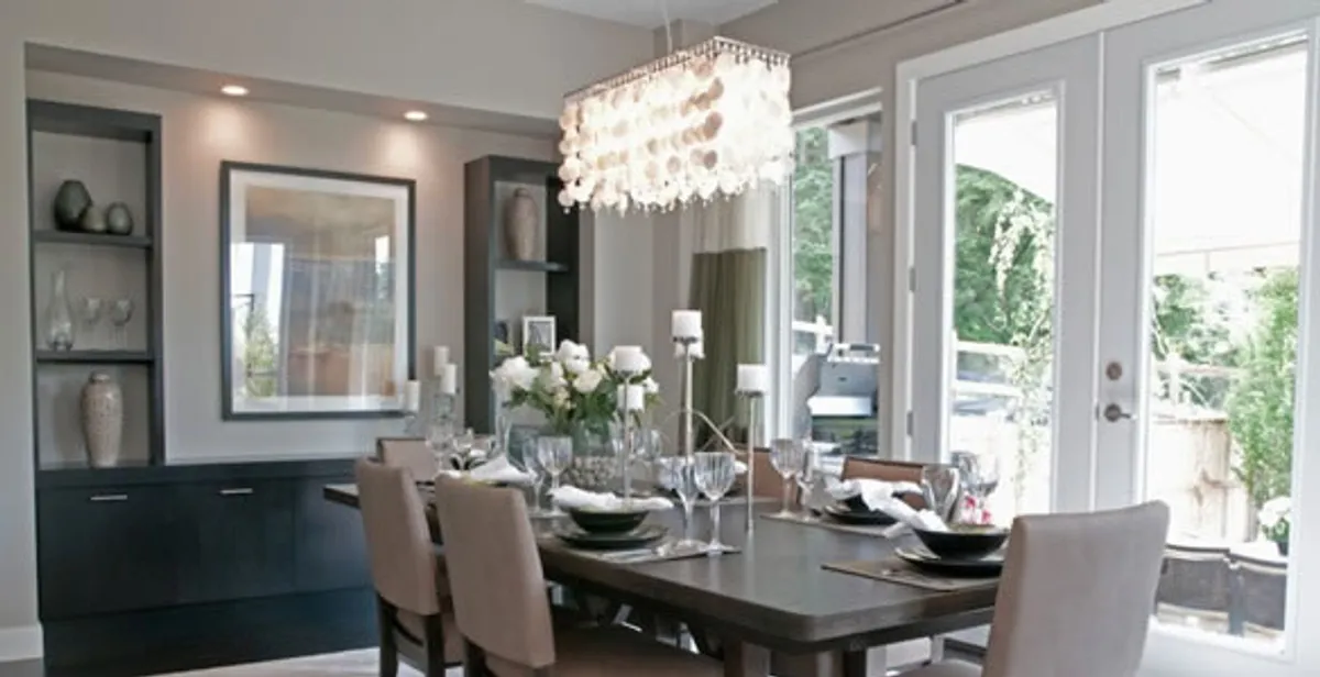 Elegant dining room chandelier installation above table in Bakersfield, CA
