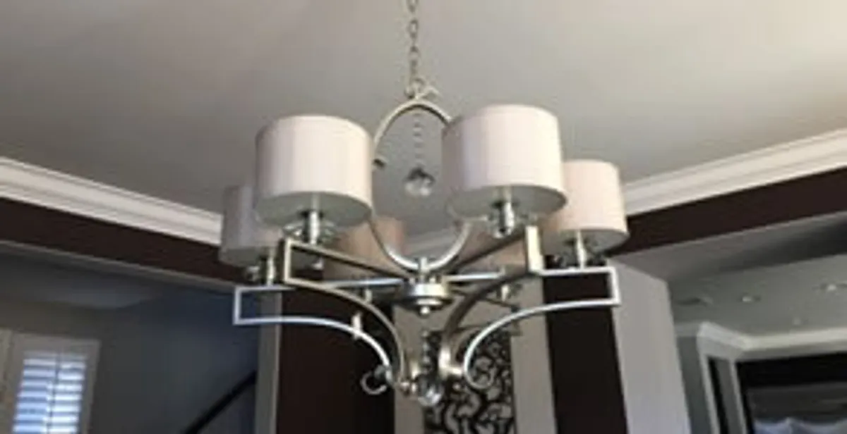 Modern chandelier installation with multiple light fixtures in Bakersfield, CA